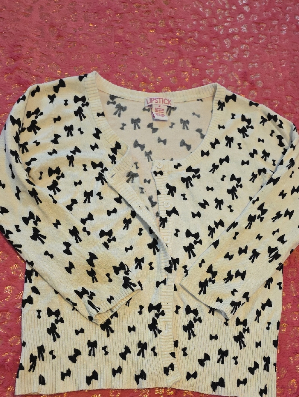 Lipstick Boutique Cream Cardigan with Black Bow Pattern